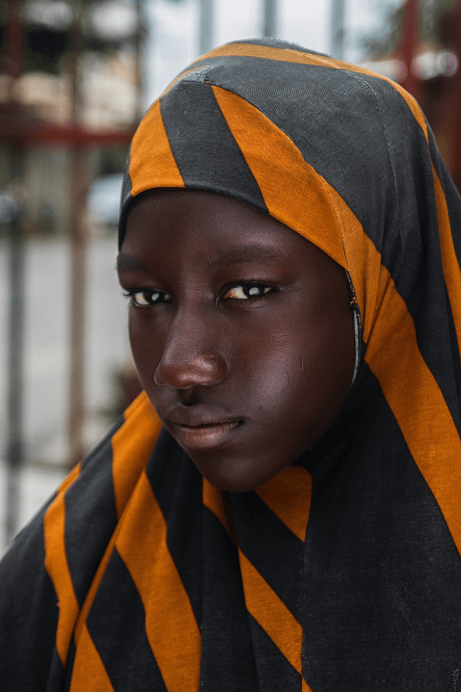 african young girl branding for ngo, orange, black